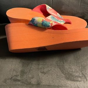 Orange wage flip flops